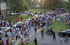 Peaceful demonstrators gather in Ferguson, Missouri, in the aftermath of Michael Brown’s death.