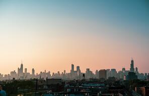 A silhouette of the Chicago City Skyline at sunrise.