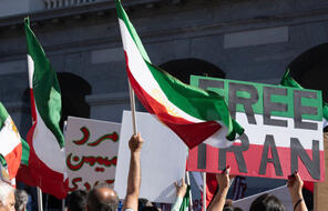 "Free Iran" sign and Iranian flags at Iranian human rights rally - Sacramento, CA