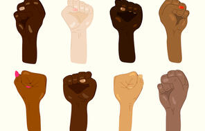Eight hands of mixed ethnicities are held up in fists.