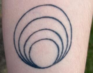 Lucie Shiffman's Universe of Obligation Tattoo 