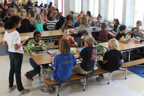 Middle-schoolers eat lunch during their daily mandate lunch break.