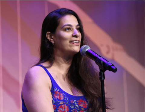 Maysoon Zayid talking into a mic