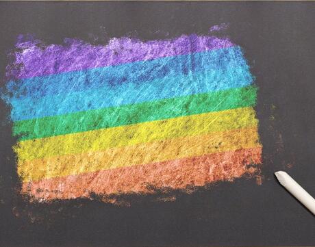 LGBTQ pride flag on chalkboard.