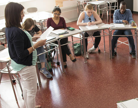 An educator walks through instructions for a teaching strategy procedure with students.