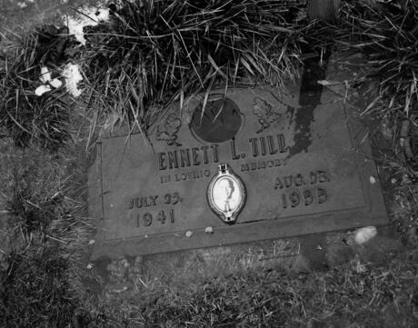 A black and white image of the grave site of Emmet Till lies submerged in melting frost at the Burr Oak cemetery on March 5, 2012 on the outskirts of Chicago, Illinois